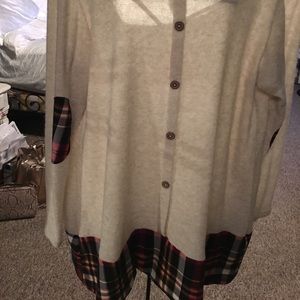 Plaid bottom and buttons up back.